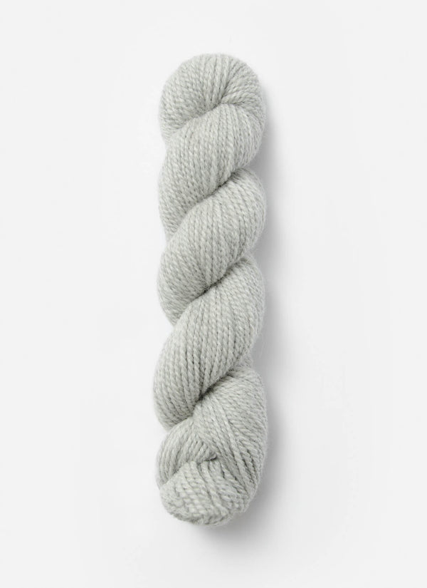 Blue Sky Fibers Baby Alpaca Sport Weight solid alpaca yarn in a soft blue shade, showcasing the smooth, lightweight fiber.