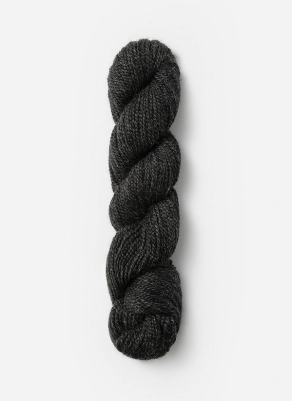 Blue Sky Fibers Baby Alpaca Sport Weight solid alpaca yarn in a soft, light blue color, showcasing the smooth texture and fiber details.