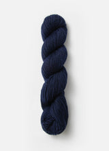 Blue Sky Fibers Baby Alpaca Sport Weight solid alpaca yarn in a soft blue color, displayed in a close-up shot.