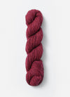 Blue Sky Fibers Baby Alpaca Sport Weight Melange alpaca yarn showcasing soft, multicolored skein in natural light.