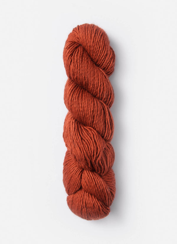 Blue Sky Fibers Suri Merino alpaca and merino yarn in soft blue color, showcasing the textured, high-quality fiber.