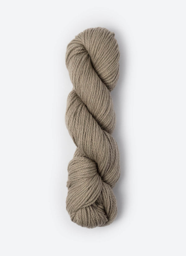 Blue Sky Fibers Sweater Worsted Superwash knitting yarn in soft blue, featuring wool and cotton blend, shown in a skein.