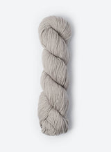 Blue Sky Fibers Sweater Worsted Superwash knitting yarn in blue, with soft wool and cotton blend texture and label visible.