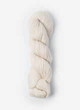 Blue Sky Fibers Sweater Worsted Superwash knitting yarn in blue, showing soft wool and cotton blend fibers for cozy knitting projects.