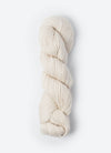 Blue Sky Fibers Sweater Worsted Superwash knitting yarn in blue, showing soft wool and cotton blend fibers for cozy knitting projects.