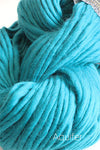 Cascade Yarns Magnum bulky yarn in Aquifer color, showing thick, soft yarn with vibrant blue and green tones.