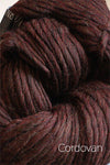 Cascade Yarns Magnum bulky yarn in a rich cordovan color, showcasing thick, soft wool fibers ideal for warm knitting projects.
