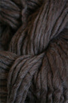 Cascade Yarns Magnum bulky yarn in mocha heather, showing thick, textured yarn strands ideal for cozy knitting projects.