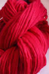 Cascade Yarns Magnum bulky yarn in vibrant poinsettia red, showcasing thick, cozy yarn ideal for warm winter projects.