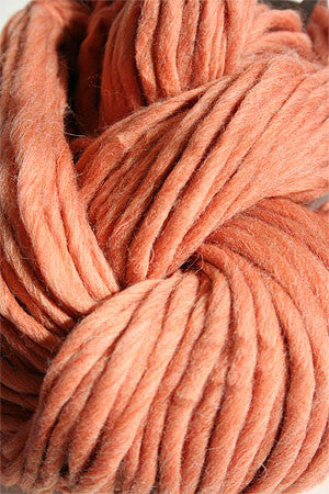Cascade Yarns Magnum bulky yarn in vibrant multicolor, showcasing thick, soft wool fibers ideal for cozy knitting projects.