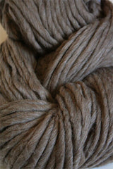 Cascade Yarns Magnum bulky yarn in walnut heather color, showcasing thick, soft yarn strands ideal for cozy knitting projects.