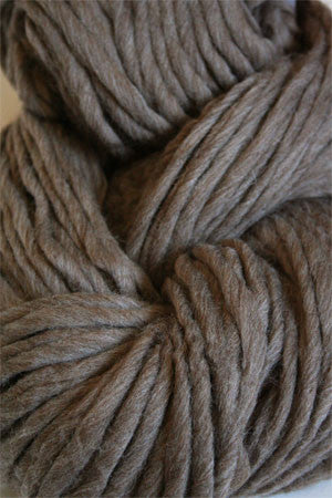 Cascade Yarns Magnum bulky yarn in walnut heather color, showcasing thick, soft yarn strands ideal for cozy knitting projects.