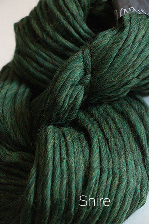 Close-up of Cascade Yarns Magnum bulky yarn in soft, variegated shades, showcasing its thick, cozy texture.