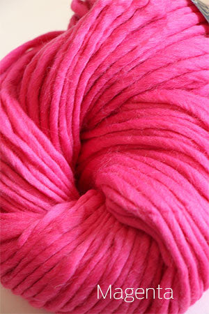 Bright magenta Cascade Yarns Magnum bulky yarn spun into thick, soft strands ideal for warm knitting projects.