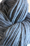 Cascade Yarns Magnum bulky denim yarn ball showing deep blue, textured yarn suitable for knitting and crochet projects.