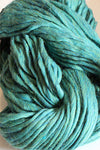 Cascade Yarns Magnum bulky yarn in Lake Chelan Heather color, showing thick, soft texture and vibrant heather tones.