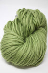Cascade Yarns Magnum bulky yarn in turtle green, showing thick, soft yarn strands suitable for cozy knitting projects.