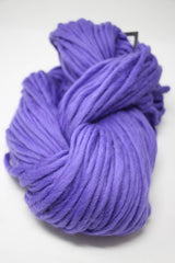 Cascade Yarns Magnum bulky yarn in vibrant ultraviolet color, showcasing thick, soft yarn ideal for cozy knitting projects.