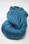 Cascade Yarns Magnum bulky yarn in celestial tea color, showing thick, soft yarn skein with vibrant teal and blue tones.