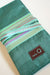 Della Q interchangeable needle case in seafoam with compartments for knitting needles and accessories.