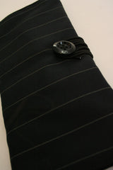 Della Q interchangeable needle case with multiple compartments for knitting needles, in a stylish fabric design.