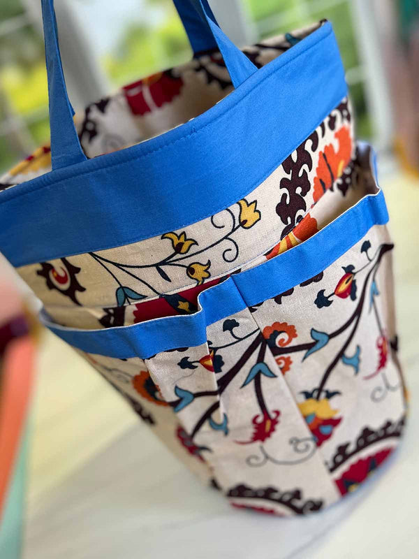 Della Q Yarn Cleo & Tess knitting bags in water-inspired colors, featuring stylish, spacious designs for yarn storage and organization.