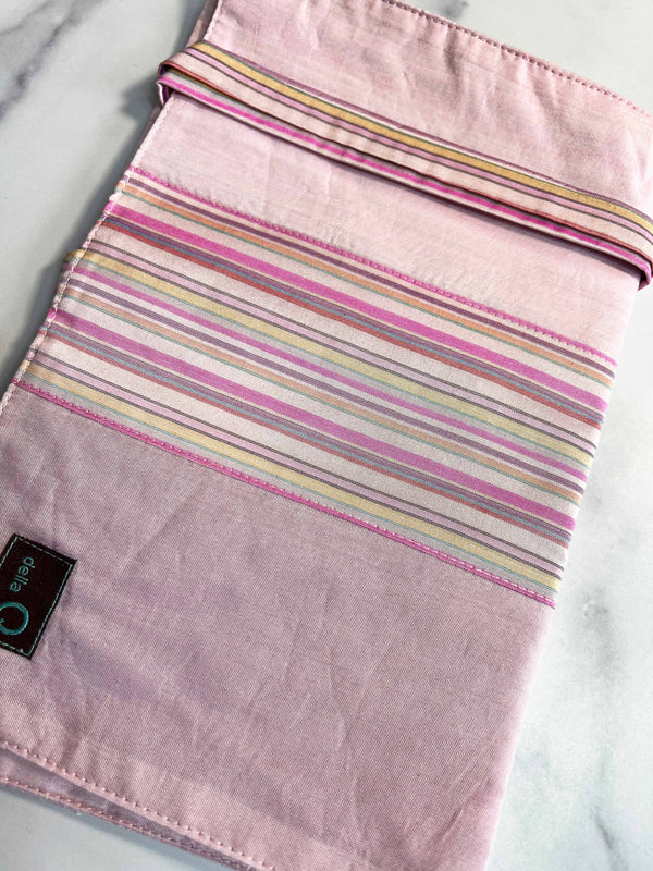 Della Q double point knitting needle case in pink and white stripes, designed to organize and protect knitting needles.
