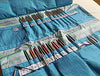 Interior of Della Q double interchangeable needle case featuring multiple compartments for organizing sewing needles and accessories.