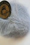 Galler Yarn Belangor French Angora soft, cream-colored angora yarn twisted into a thick strand for knitting or crocheting projects.