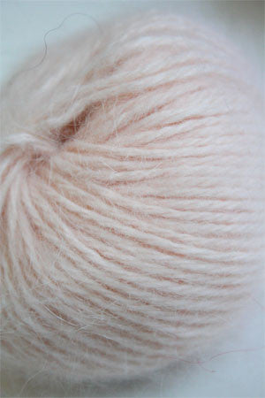 Soft Belangor French Angora yarn by Galler Yarn, showing delicate, fluffy fibers in a natural off-white color.