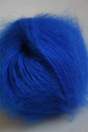 Soft Belangor French Angora yarn by Galler Yarn, showcasing delicate, fluffy angora fibers in a natural off-white color.