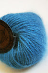 Galler Yarn Belangor French Angora angora yarn skein with soft, fluffy texture and natural cream color for knitting or crocheting projects.