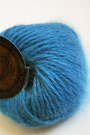 Galler Yarn Belangor French Angora angora yarn skein with soft, fluffy texture and natural cream color for knitting or crocheting projects.