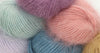 Soft Belangor French Angora yarn by Galler Yarn, showcasing delicate, fluffy angora fiber in natural cream color.