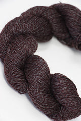 Jade Sapphire Sylph linen and cashmere yarn in a soft prune color, showcasing smooth, twisted fibers ready for knitting or knitting projects.