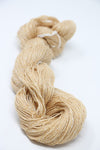 Close-up of Jade Sapphire Sylph linen and cashmere yarn in a soft, natural Dunes color, showcasing its smooth texture and fine fibers.