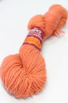 Jade Sapphire Zageo 6 Ply Cashmere yarn in vibrant blood orange color, showcasing soft, luxurious cashmere fibers.