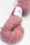 Close-up of Jade Sapphire Zageo 6 Ply Cashmere yarn in Hibiscus color, showcasing soft, luxurious cashmere fibers.