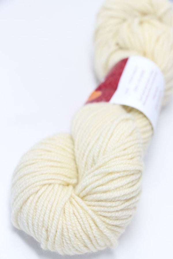 Jade Sapphire Zageo 6 Ply Cashmere yarn in a soft jasmine color, showing the smooth, spun cashmere strands for knitting or weaving.