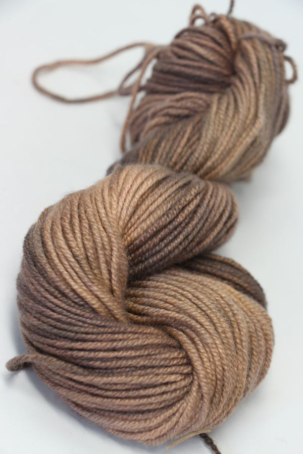 Jade Sapphire Cashmere Zageo 6 Ply Cashmere Yarn in sandstone color, showcasing soft, luxurious cashmere fibers.