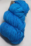 Blue Nelie Madelinetosh Tosh DK yarn ball showing soft wool texture and vibrant color for knitting or crochet projects.