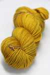 Madelinetosh Tosh DK yarn in Candlewick color, soft and versatile wool blend suitable for knitting and crochet projects.