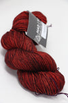 Madelinetosh Tosh DK yarn in Cardinal color, soft and lightweight wool for knitting and crochet projects.