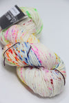 Madelinetosh Tosh DK yarn in Holi Festival colorway, soft wool blend with vibrant multicolor dye, ideal for knitting and crochet projects.