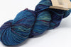 Madelinetosh Tosh DK yarn in vibrant Mandala colorway, soft wool for knitting and crochet projects, close-up of yarn skein.
