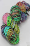 Colorful skein of madelinetosh Tosh DK yarn in Electric Rainbow, showcasing vibrant, multicolored wool for knitting or crochet projects.