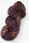Madelinetosh Tosh DK yarn in Wicked colorway, soft wool blend, shown wound into a skein for knitting or crochet projects.