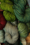 Soft Madelinetosh Tosh DK yarn in vibrant colors, displayed in a close-up shot showing its texture and rich fiber quality.