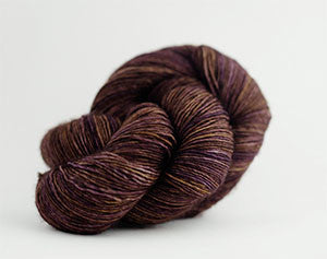 Madelinetosh Tosh DK yarn in Geode color, soft and vibrant dyed wool for knitting or crochet projects.