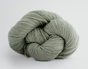 Madelinetosh Tosh DK yarn in Silverleaf color, soft wool and silk blend, showcasing the vibrant, variegated knitting yarn.